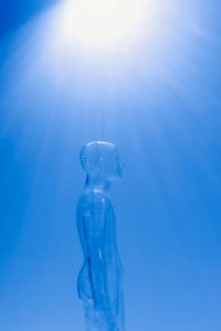Clear mannequin on blue background. Photo by Tara Winstead.